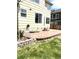 The patio has a retaining wall and stairs to the backyard at 5988 W Crestline Ave, Littleton, CO 80123