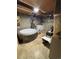A partially finished basement with laundry area featuring an inflatable jacuzzi at 7795 Raritan St, Denver, CO 80221