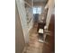 This bathroom offers accessibility with a walk in tub/shower and a comfort seat at 7795 Raritan St, Denver, CO 80221