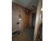 Home entryway featuring wood wall paneling and a paneled wood door at 7795 Raritan St, Denver, CO 80221