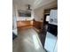 Cozy eat-in kitchen featuring a built-in corner bench and tile flooring at 7795 Raritan St, Denver, CO 80221