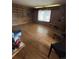 Spacious living room featuring hardwood floors, shelving, and natural light at 7795 Raritan St, Denver, CO 80221