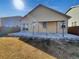 Backyard featuring a covered patio area and low-maintenance landscaping at 120 Sabin Way, Lochbuie, CO 80603