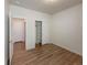 Bright bedroom features a closet, wood floors, and neutral paint, offering a serene retreat at 120 Sabin Way, Lochbuie, CO 80603
