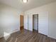 Bedroom with wood floors, closet, and white painted doors at 120 Sabin Way, Lochbuie, CO 80603