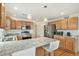 Modern eat-in kitchen with island, stainless appliances, and granite countertops at 24285 E Wagon Trail Ave, Aurora, CO 80016