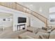 Open living room with vaulted ceilings, fireplace, and staircase at 24285 E Wagon Trail Ave, Aurora, CO 80016