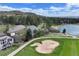 Breathtaking aerial view of home located on the golf course near pond and sand trap at 1361 Castlepoint Cir, Castle Pines, CO 80108