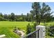 Scenic view of the lush backyard and golf course from the home's deck, perfect for relaxation at 1361 Castlepoint Cir, Castle Pines, CO 80108