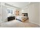 Cozy bedroom featuring a comfortable bed, soft lighting, and elegant furnishings at 1361 Castlepoint Cir, Castle Pines, CO 80108