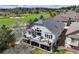 Lovely exterior featuring large deck with expansive golf course views at 1361 Castlepoint Cir, Castle Pines, CO 80108