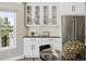 Bright eat-in area featuring stainless steel appliances, white cabinetry, and views of the surrounding landscape at 1361 Castlepoint Cir, Castle Pines, CO 80108