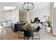 Spacious living area featuring an open layout, modern decor, and seamless flow to the kitchen and dining areas at 1361 Castlepoint Cir, Castle Pines, CO 80108