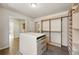 Large walk-in closet with custom shelving, drawers, and ample storage space for organization at 1361 Castlepoint Cir, Castle Pines, CO 80108