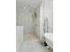 Elegant shower offers a sleek glass door, rainfall showerhead, and designer tiling complementing the luxurious bath at 535 N High St, Denver, CO 80218