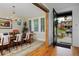 Elegant dining room with hardwood floors, large windows, and a chandelier, adjacent to the front entrance at 535 N High St, Denver, CO 80218