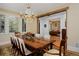 Classic dining room boasting hardwood floors, a chandelier, ample windows, and access to an adjacent office space at 535 N High St, Denver, CO 80218