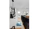 Hallway with a small seating area, decorative light fixture, and natural light from adjacent windows at 535 N High St, Denver, CO 80218