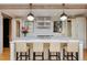 Open kitchen with a large marble island, stainless steel appliances, and modern lighting fixtures at 535 N High St, Denver, CO 80218