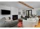 Cozy living room with fireplace, hardwood floors, comfortable seating, and natural light at 535 N High St, Denver, CO 80218