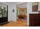 Office featuring hardwood floors, a built-in desk, and large windows offering views of the front yard at 535 N High St, Denver, CO 80218