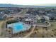 Aerial view of the community pool and clubhouse, highlighting community amenities and residential area at 9645 Browns Peak Cir, Littleton, CO 80125