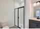 Modern bathroom with tiled shower and sleek vanity at 9645 Browns Peak Cir, Littleton, CO 80125