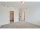 A bright bedroom with neutral carpet and two entryways for closet and bathroom access at 9645 Browns Peak Cir, Littleton, CO 80125