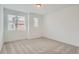 Minimalist bedroom with carpet and large windows allowing for natural light at 9645 Browns Peak Cir, Littleton, CO 80125