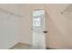 A closet with metal shelving, carpet and a view of the bedroom at 9645 Browns Peak Cir, Littleton, CO 80125