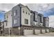 Modern townhomes showcase a blend of brick and siding, creating a stylish and contemporary exterior at 9645 Browns Peak Cir, Littleton, CO 80125