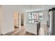 Bright kitchen with an island, stainless steel appliances, and open access to a walk-in pantry at 9645 Browns Peak Cir, Littleton, CO 80125