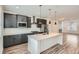 Spacious kitchen featuring gray cabinets, granite countertops, and stainless steel appliances at 9645 Browns Peak Cir, Littleton, CO 80125