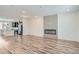 Open-concept living room with wood-look flooring and a modern fireplace feature at 9645 Browns Peak Cir, Littleton, CO 80125