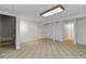 Finished basement boasts updated flooring, recessed lighting, and versatile spaces for recreation or storage at 1847 S Union Blvd, Lakewood, CO 80228