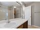 The bright bathroom features a vanity, contemporary fixtures, and a shower and bathtub at 1847 S Union Blvd, Lakewood, CO 80228