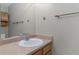 Bathroom featuring a large mirror, stylish fixtures, and a clean, bright vanity area at 1847 S Union Blvd, Lakewood, CO 80228