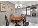 Cozy dining area with wood furniture, classic light fixture, and easy access to the living room at 1847 S Union Blvd, Lakewood, CO 80228