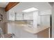 Bright kitchen that features white cabinets, a skylight, butcher block countertops, and an open layout at 1847 S Union Blvd, Lakewood, CO 80228