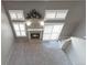 A bird's eye view of a sunlit living room featuring a fireplace, and neutral decor at 1847 S Union Blvd, Lakewood, CO 80228
