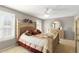 Comfortable main bedroom features natural light from shuttered windows, a ceiling fan, and a dresser at 1847 S Union Blvd, Lakewood, CO 80228