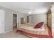 This bedroom features a ceiling fan, a dresser, and an en suite bathroom at 1847 S Union Blvd, Lakewood, CO 80228