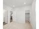 View from bedroom towards kitchen, bathroom and closet, showcasing open floor plan at 8809 Sedalia St, Commerce City, CO 80022