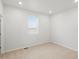 Bright bedroom with neutral carpet and a window, offering a serene retreat at 8809 Sedalia St, Commerce City, CO 80022