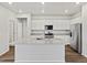 Modern kitchen with granite counters, a large island, and stainless steel appliances at 8809 Sedalia St, Commerce City, CO 80022