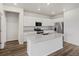 Modern kitchen with granite counters, a large island, and stainless steel appliances at 8809 Sedalia St, Commerce City, CO 80022
