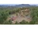 Stunning aerial view of a beautiful home nestled in the mountains at 28940 Pinewood Vista Dr, Evergreen, CO 80439