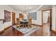 Basement dining area with wooden table and chairs at 28940 Pinewood Vista Dr, Evergreen, CO 80439