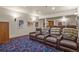 Enjoy movie nights in this finished basement home theater with comfortable seating at 28940 Pinewood Vista Dr, Evergreen, CO 80439