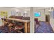 Basement home theater with comfortable seating and a large screen TV at 28940 Pinewood Vista Dr, Evergreen, CO 80439